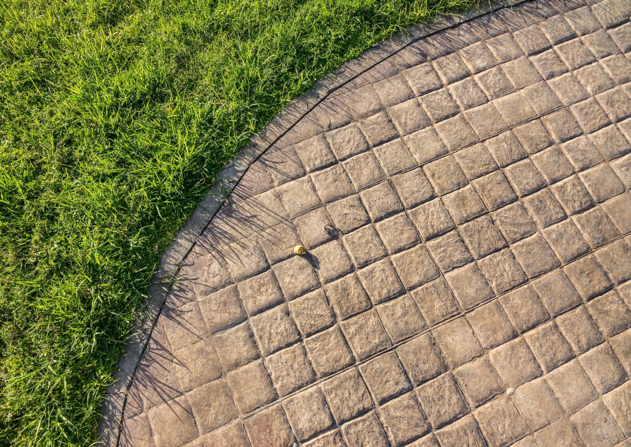 Stamped concrete pavement outdoor cobblestones pattern